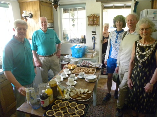 Volunteers serve coffee and cake